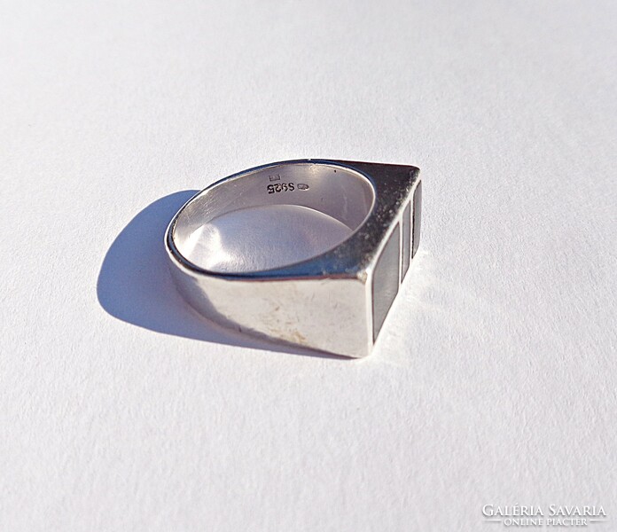 Silver ring with black inlay