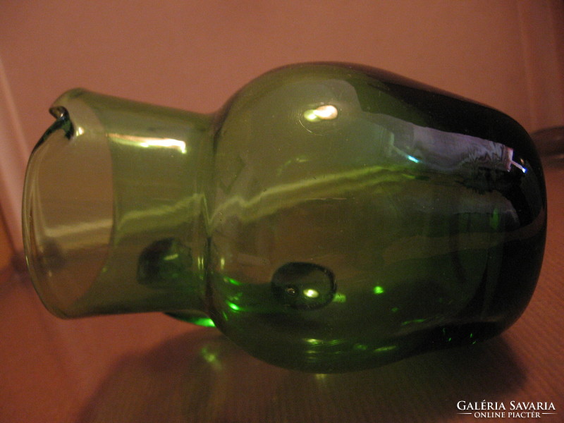 Small green blown glass jug