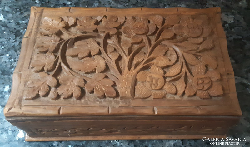 Hand-carved floral wooden box with tricky door opener