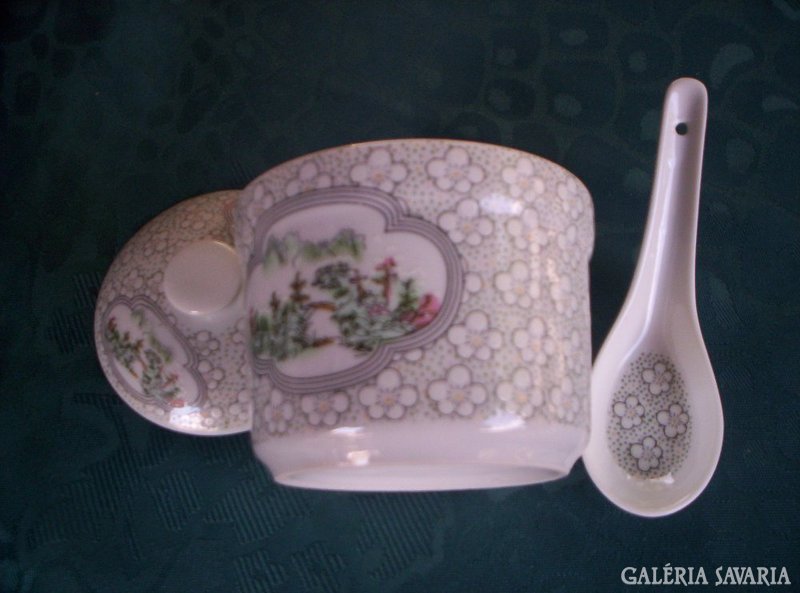 With a small porcelain spoon with a lid. X