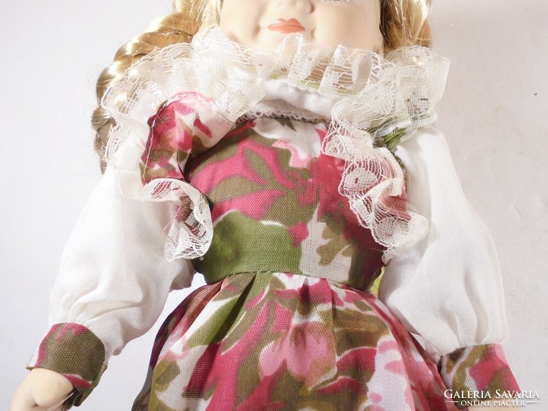 Retro vintage old toy porcelain doll with braided hair