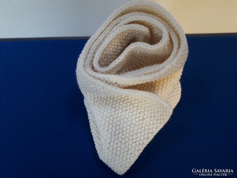 Hand-knitted, off-white scarf