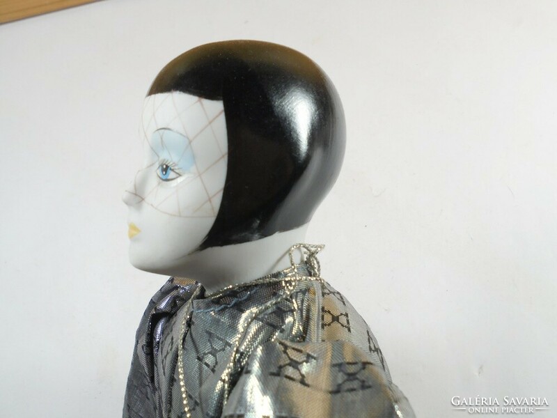 Retro old toy doll with porcelain head and Venetian carnival costume