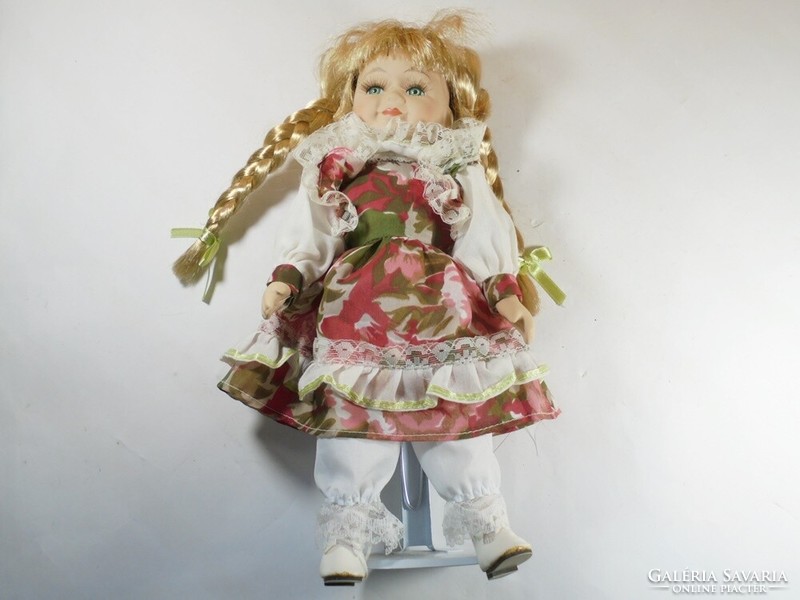 Retro vintage old toy porcelain doll with braided hair