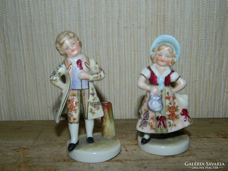Pair of children in antique Hummel and Goebel baroque clothes