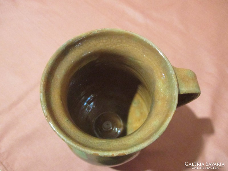 A small pot, a jug, a jug