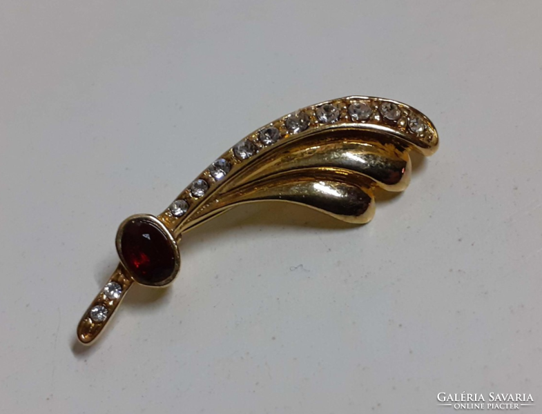 Old high-quality gold-plated brooch in beautiful condition, decorated with burgundy and small shiny stones
