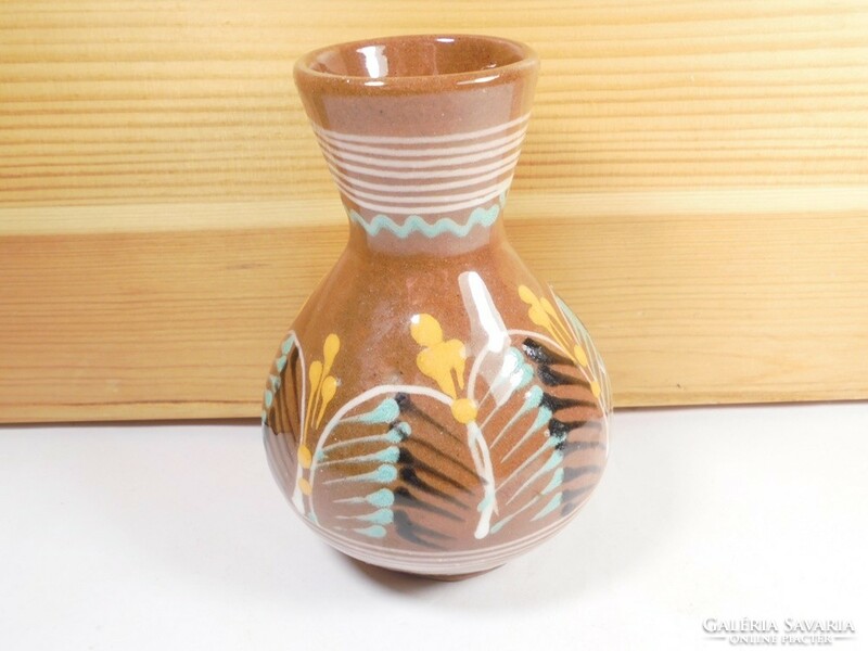 Old retro ceramic vase with flower pattern folk art