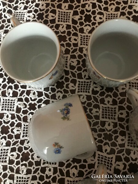Porcelain coffee cups with flower pattern decor, work of an unknown manufacturer. In undamaged condition