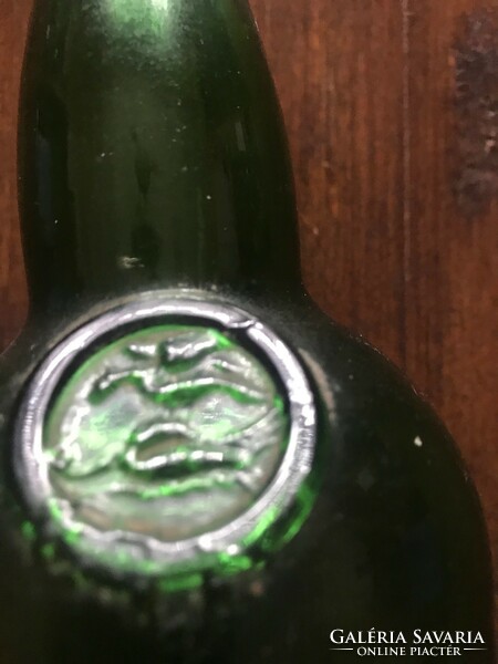Green glass bottle embossed with the inscription Graham. In undamaged condition. 30X7 cm.