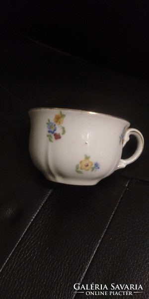 Thick antique cup with scattered flowers