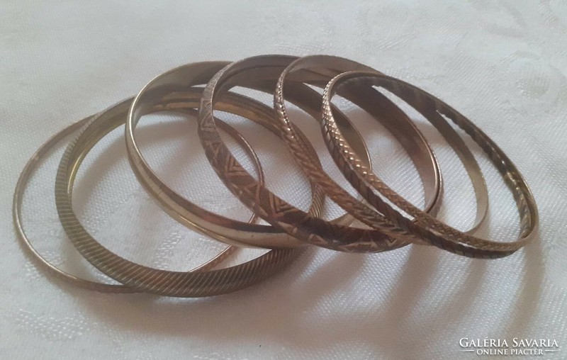 Copper-colored bracelets together (8 pcs.)