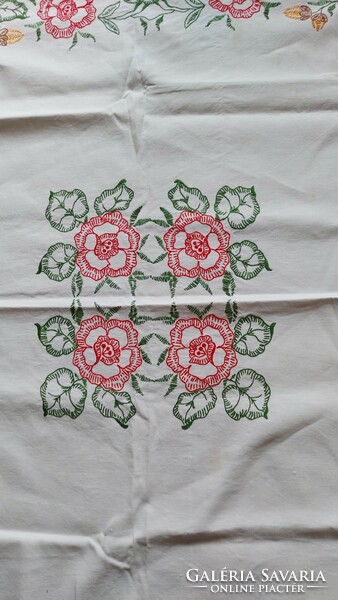 Old embroidered tablecloth with large folk flower patterns
