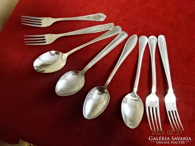 Chrome cutlery, four spoons, four forks, all different. Jokai.