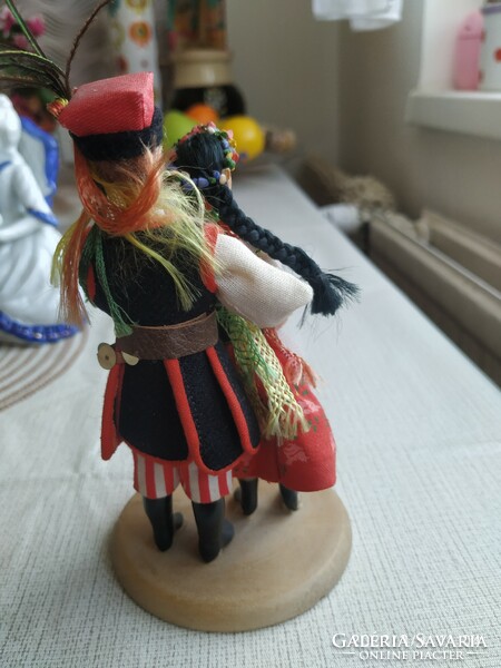 Boys and girls dressed in Polish folk costumes, on wooden legs for sale! Decoration
