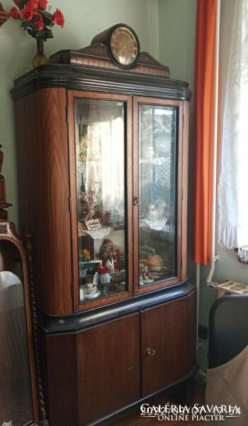 Antique display cabinet with clock