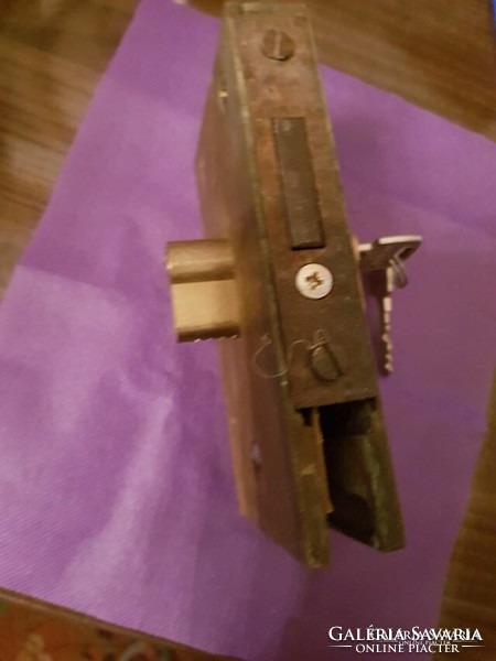 Copper floor lock with key from silver beach hotel, boutique