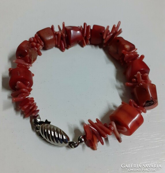 A bracelet made of coral beads in good condition with a silver-plated jewel switch