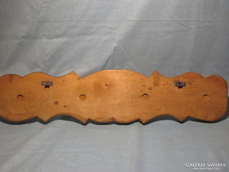 Old beautiful wooden hanger with hanger