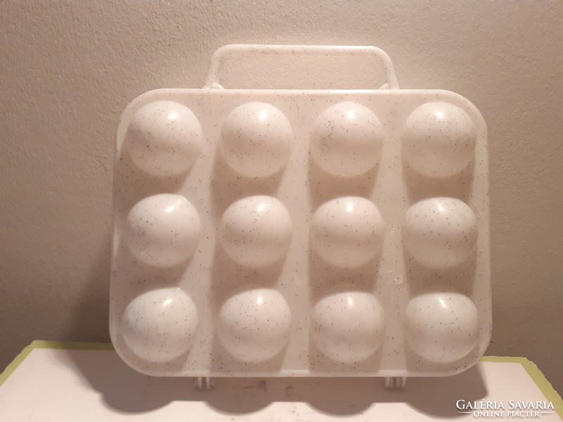 Retro plastic egg cup with old egg storage box