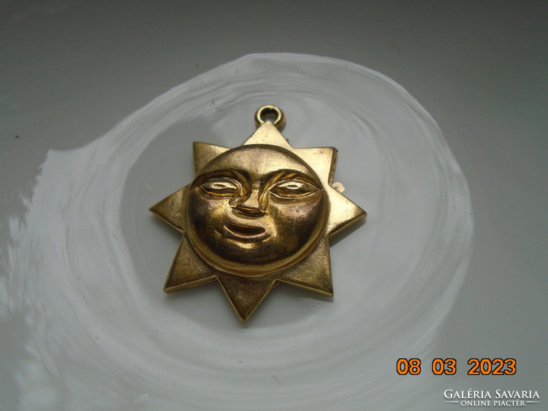 Plastic gold-plated marked sunbeam pendant