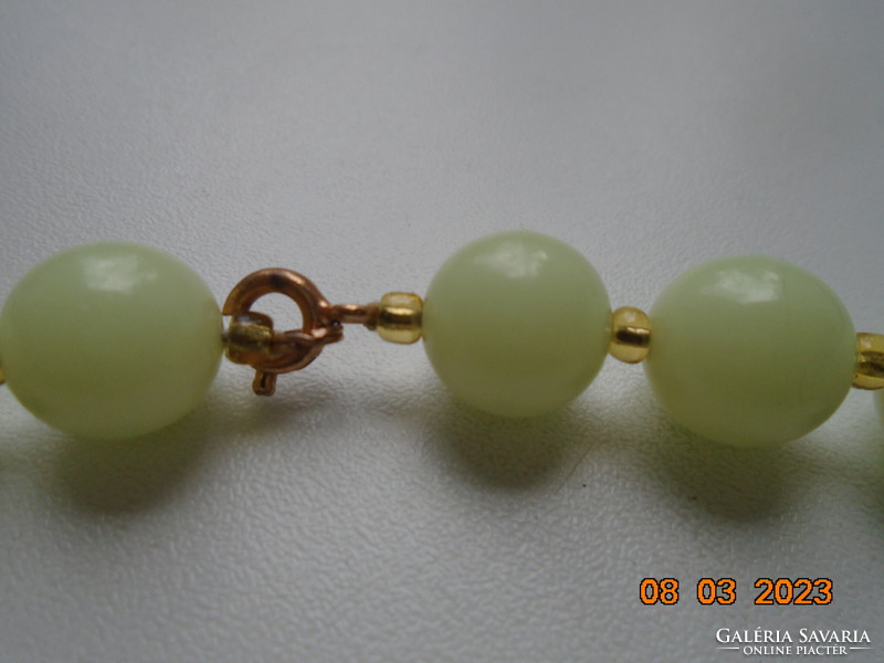 Jade-colored, phosphorescent, individually looped pearls with blue gold-plated clasp