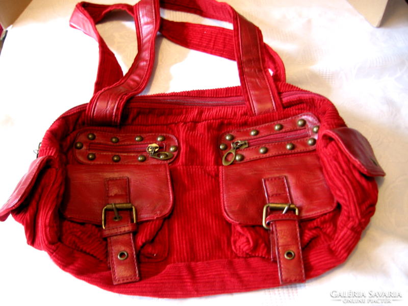 Red cord velvet bag with copper buckles and rivets