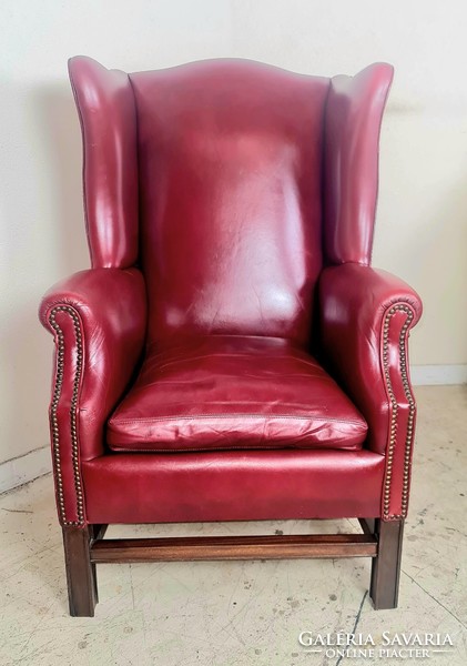 Antique English chesterfield winged leather armchair