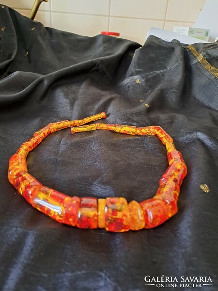 Long, cast, but beautiful amber collars with huge eyes
