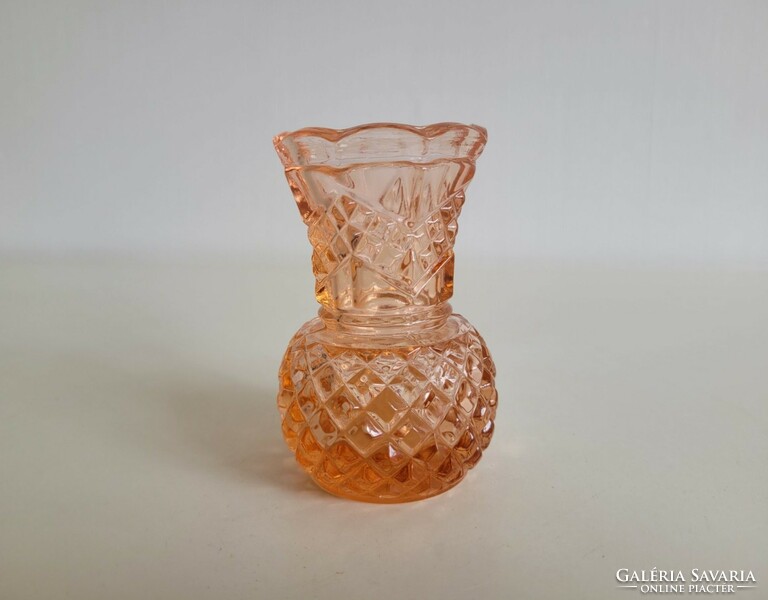 Old glass vase in salmon color