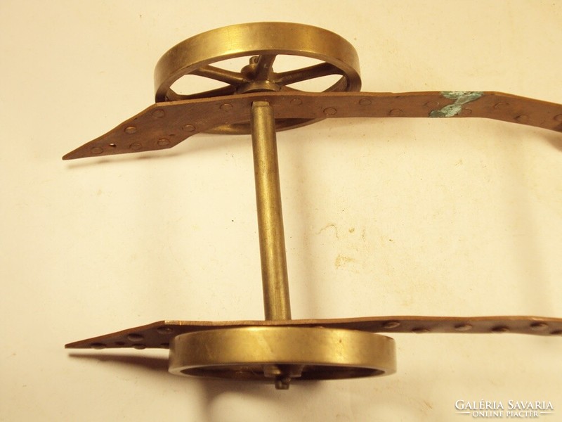 Copper wheeled chariot-like supporting ornament with riveted, turned wheel