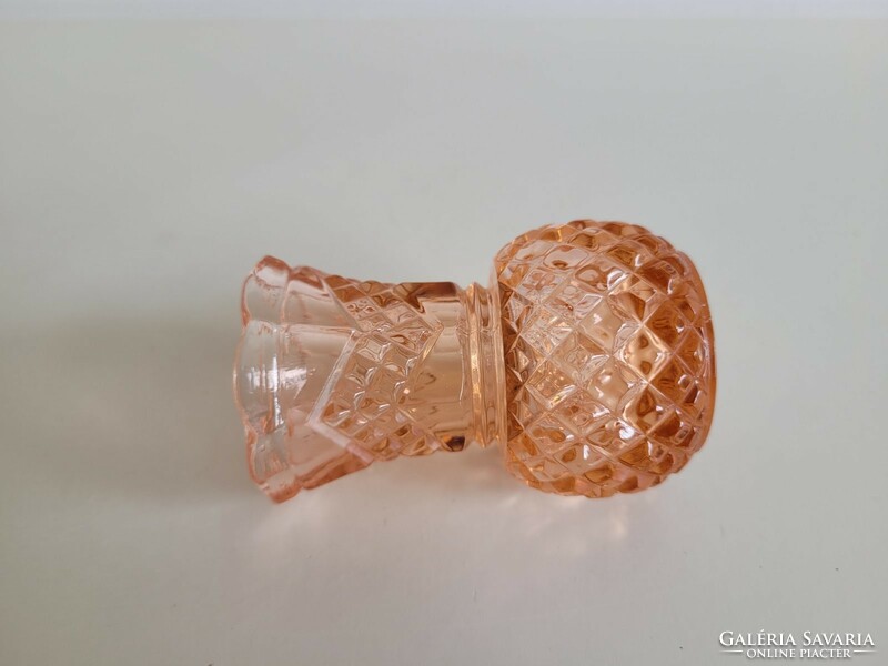 Old glass vase in salmon color