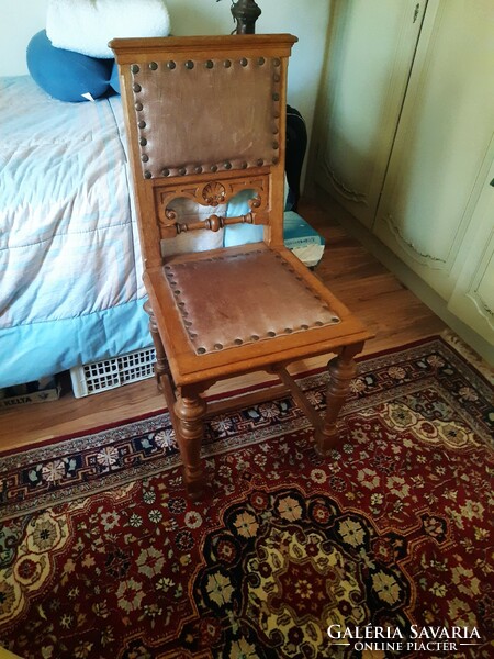 Antique chair with leather upholstery