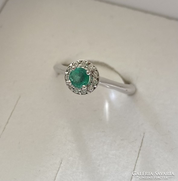 18 carat white gold ring with emeralds and diamonds!