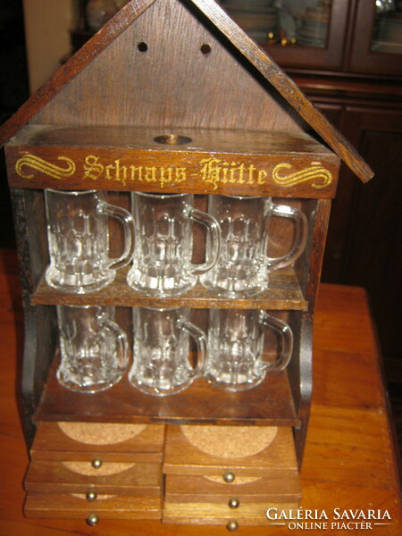 Schnapps set in a cottage with a glass coaster