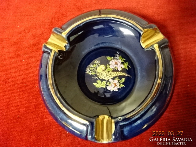 German glazed ceramic ashtray. Cobalt blue background with gold pheasant pattern. Jokai.