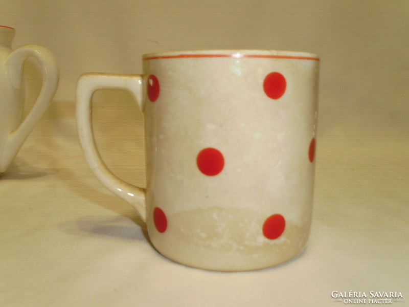 Three old red polka dot granite mugs together - one belly, two tea