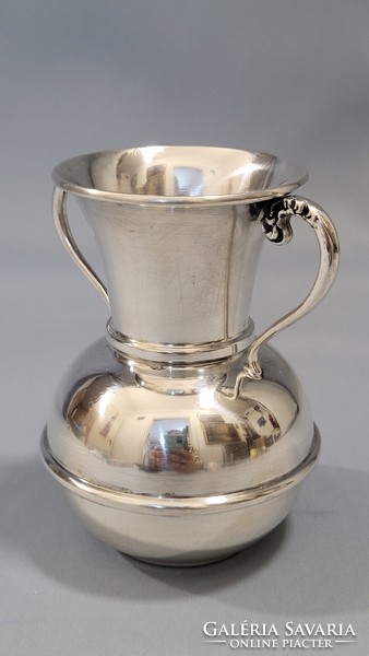 Old silver vase with two ears