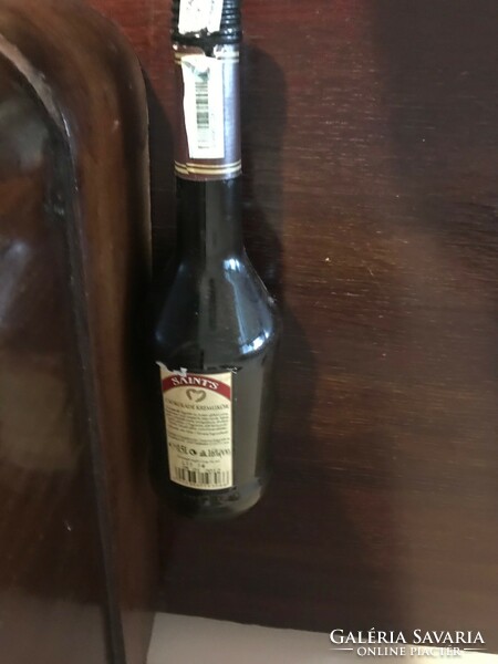 Saints chocolate liqueur glass bottle. Crem liquer. In undamaged condition. Size: 26 cm high