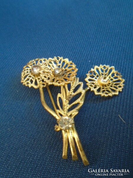 Old brooch with three flower stalks