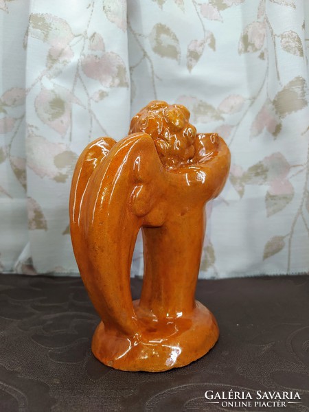 Yellow ceramic putto candle holder