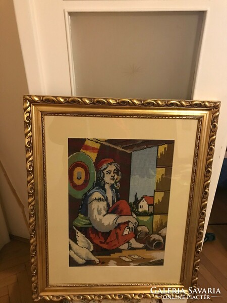 Picture made with Gobelin technique, in a gilded frame. 60X72 cm in completely new condition.