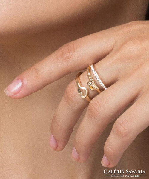 Gold-colored love ring with a heart and crystals