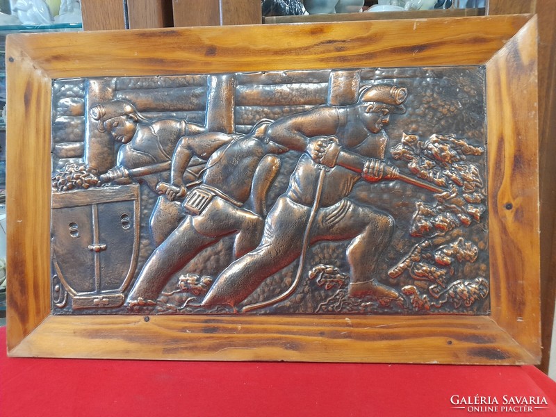 Embossed bronze miners wall picture.