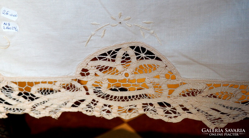 Beautiful embroidered tablecloth decorated with ribbon crochet