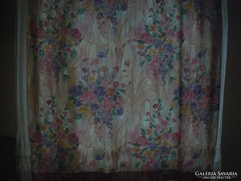 A pair of cheerful floral summer blackout curtains in a beautiful vintage style