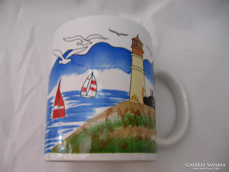 Coastal landscape with mug lighthouse, sailboats and seagulls