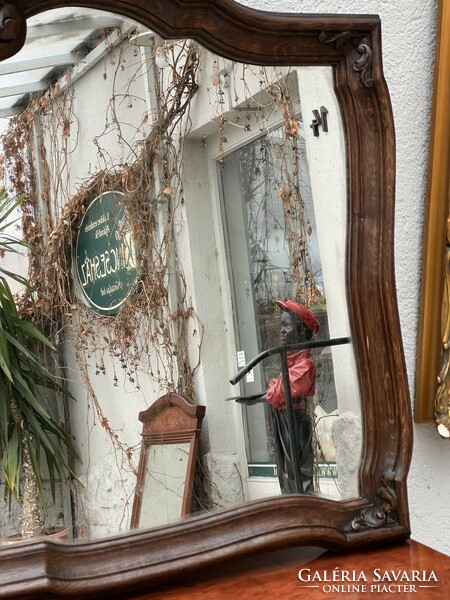 Antique baroque wall mirror carved from oak wood, curved lines with original mirror