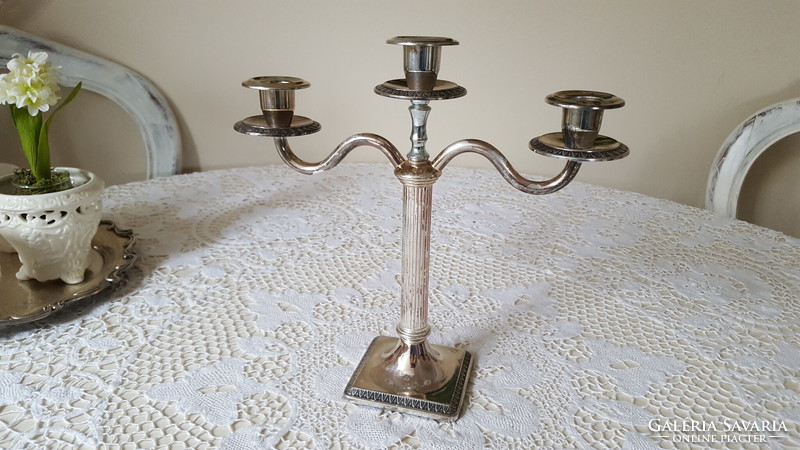 Elegant, three-pronged silver-plated candle holder