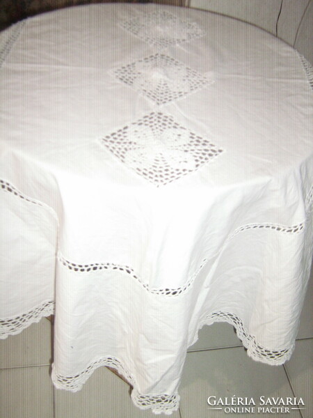Antique elegant oval linen tablecloth with beautiful hand-crocheted inserts with lace crocheted edges
